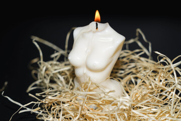 Handmade candle in the shape of a beautiful female torso made of soy wax.
