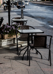 Fototapeta na wymiar table and chairs at a sidewalk cafe.