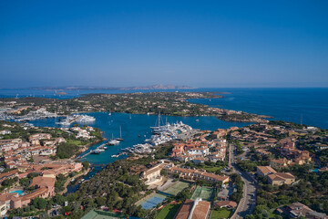 Naklejka na ściany i meble Aerial View of Porto Cervo, Italian seaside resort in northern Sardinia, Italy. Drone view Centre of Costa Smeralda. One of the most expensive resorts in the world.