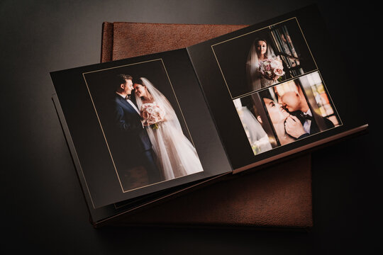 wedding photobooks in brown leather binding with photos on the cover