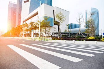 Asphalt road and modern building in city