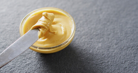 Image of close up of peanut butter on gray background