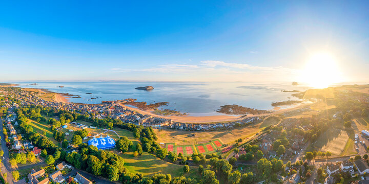 UK, Scotland, North Berwick, Aerial Panorama Of Coastal Town At Summer Sunset