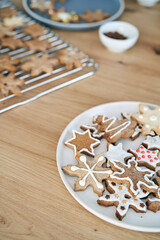 Fototapeta na wymiar Detail of decorated Christmas cookies on kitchen worktop