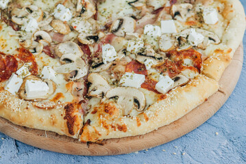 Deluxe Pizza with Pepperoni, Sausage, Mushrooms and Peppers .