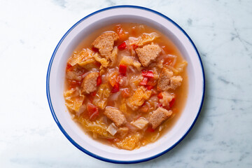 Menorcan soup. Traditional recipe from the island of Menorca in the Balearic Islands. Traditional tapas from the islands with bread, peppers and white cabbage.
