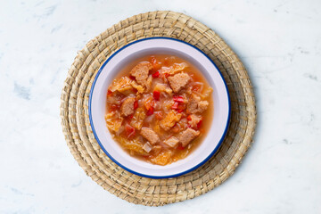 Menorcan soup. Traditional recipe from the island of Menorca in the Balearic Islands. Traditional tapas from the islands with bread, peppers and white cabbage.