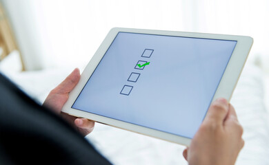 People using digital tablet  voting online