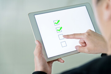 People using digital tablet  voting online