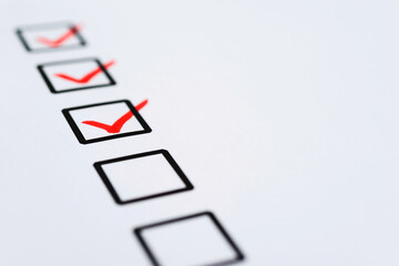 Check list and marker on white paper
