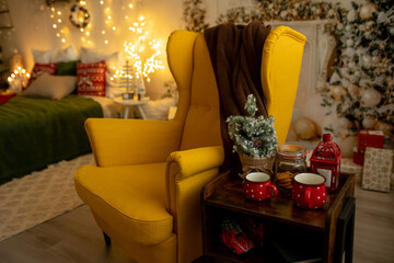 Empty yellow armchair in a decorated room for Christmas