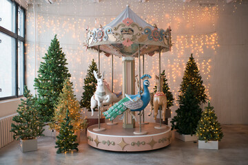 Indoor carousel with animals © Lys Owl