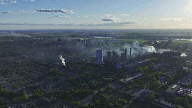 Chimney And Cooling Towers Of Industrial Plant Of SC Electrocentrale Galati And Eco-Metal Recycling SRL Emitting Polluted Smoke In The Air. - aerial