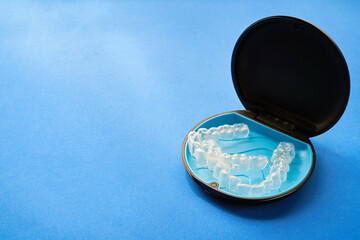Transparent invisible dental aligners or braces applicable to orthodontic treatment and their containers.