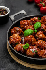 Traditional spicy meatballs in sweet and sour tomato sauce. Restaurant menu, dieting, cookbook recipe top view