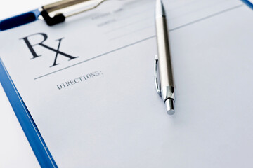 Closeup of clipboard, pen and medical stethoscope