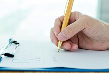 Close up of doctor hands writing prescription paper