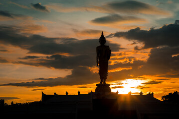 Silhouette of Buddha with sunset light