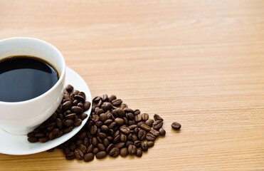 Coffee and beans on wooden table