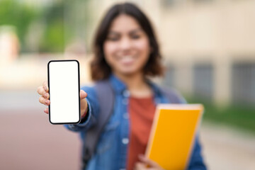 Educational App. Arab Female Student Holding Blank Smartphone In Hand