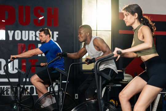 Group of multiethnic athlete fitness trainer friends workout in gym.