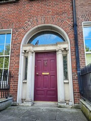 Purple georgian door in Dublin, example of typical architecture of Dublin, Ireland