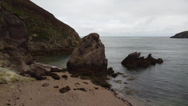 Slider Shot Of Peaceful Seascape, Porth Wen Rocky Beach, United Kingdom