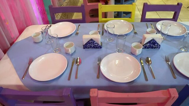 Colorful Service Table Set With Napkin Rings In Restaurant With Southern Hispanic, Texan Or Mexican Characteristics