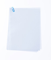 Blank paper with paperclip on white background