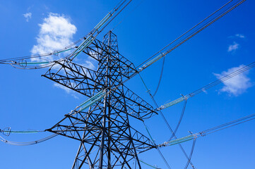 Electricity pylons. Energy concept. Electricity tower structure under blue sky