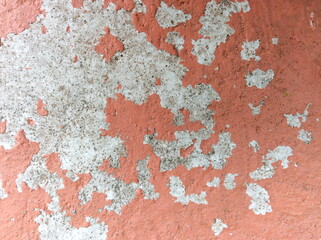 Old wall background - city building decay texture. Urban decline pattern with peeling paint.