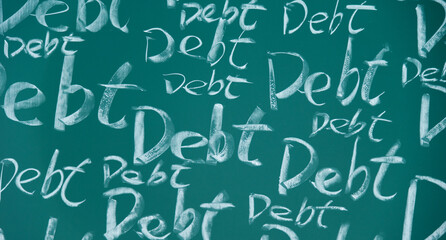 Many debt word written on chalkboard