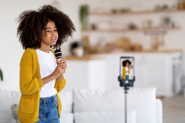 African american kid singing in front of camera