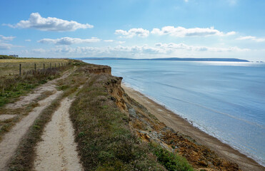 Fototapeta na wymiar view of coastal landscape from top of cliff. Coastline trail with sea view in south of England.