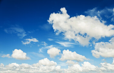 White fluffy clouds on blue sky