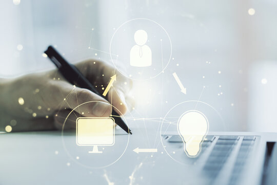 Social network media concept with hand writing in diary on background with laptop. Double exposure