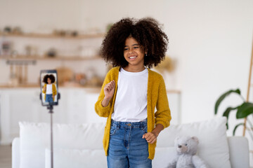 Beautiful black girl recording video for her friends