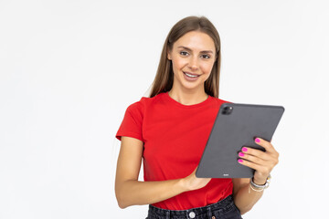 Fototapeta premium Happy woman using tablet. Smiling woman with tablet pc, isolated on grey background