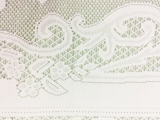 Obraz premium White lace isolated on brown background