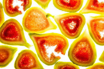 slices of sweet fresh figs on a white background - food background