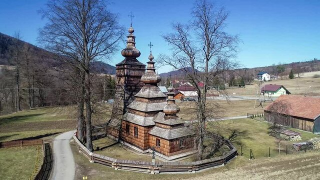 St. Paraskevi wooden church in Kwiatoń, Poland.  Built in 17th century. Originally an eastern orthodox church (tserkva), now a Roman Catholic church. UNESCO World Heritage Site. Aerial video