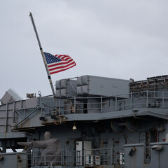 
A FLAG ON A WARSHIP - American  amphibious assault ship on a visit to the port
