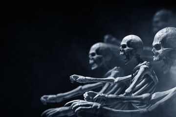 Fototapeta na wymiar Group of skeleton on dark background