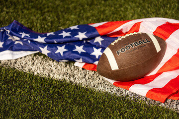 american football ball and flag