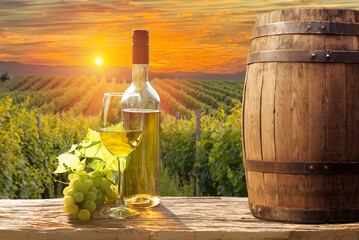 Glass Of Wine With Grapes And Barrel On A Sunny Background. Italy Tuscany With Grapes And Barrel On...