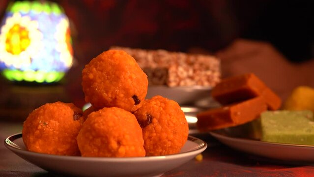 Peanut chikki candy gajak, Laddu, Indian sweet foods specially made for festivals of India like Diwali, Dussehra, Holi, ganesh chaturthi, Ram navami, Durga pooja, durga ashtami, Navratri.