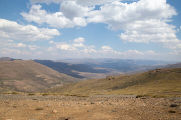 Sani mountain pass with sky and clouds out of focus with grain