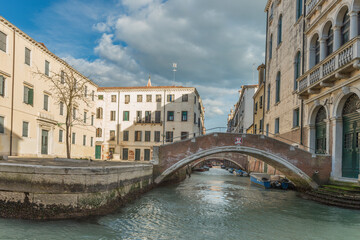 Fototapeta na wymiar Bridge over interior channel in Venice