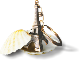 Eiffel Tower keychain in a shell for a travel souvenir