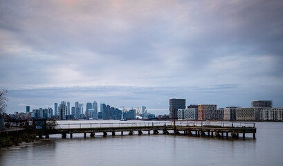 Long exposure view of Canary Wharf and Thames barrier in London